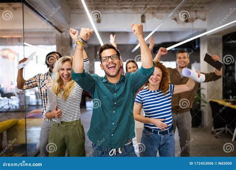 Happy Business People Celebrating Success At Company Stock Photo