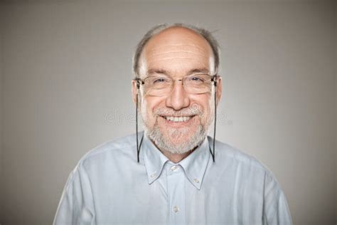 Portrait Of Old Man Taking Glasses And Smiling Royalty Free Stock