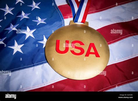 Large Usa Gold Medal With Red White And Blue Ribbon On Textured Stars