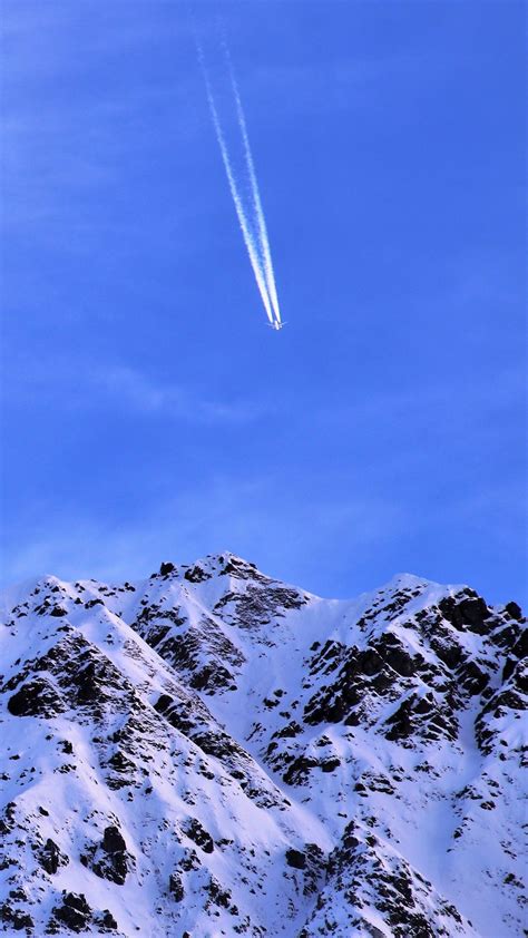 Download Wallpaper 1080x1920 Mountain Snow Plane Sky Snowy Flight