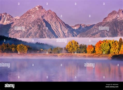 Autumn Landscape Scene At Dawn With Colorful Foliage Reflected In