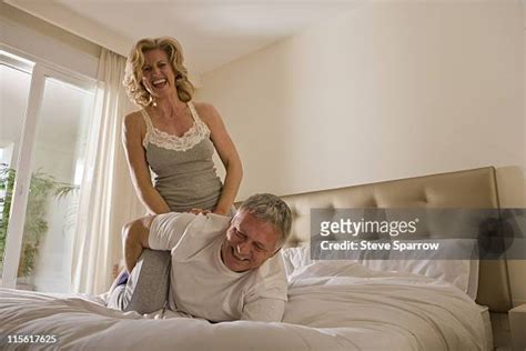 Woman Straddling Guy In Bed Photos And Premium High Res Pictures