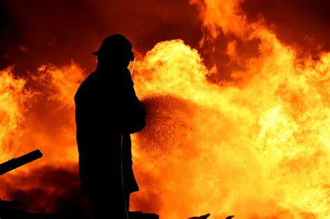 Fireman Fighting A Fire Targetsolutions