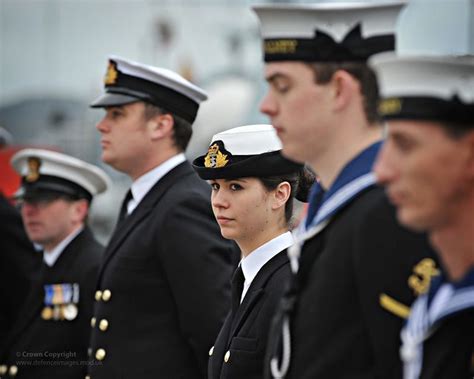 Crew Members From Hms Walney Line The Deck During The Ships