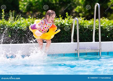 Kids Jumping Into Swimming Pool Stock Image Image Of Girl Child
