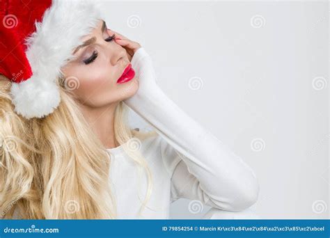 Beautiful Blonde Female Model Dressed As Santa Claus In A Red Cap Stock Photo Image Of Baubles