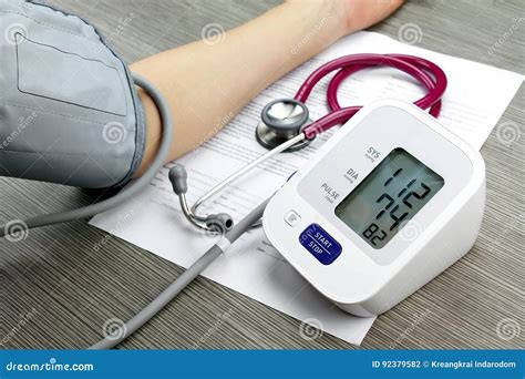 Doctor Measuring Blood Pressure Of Patient Stock Photo Image Of