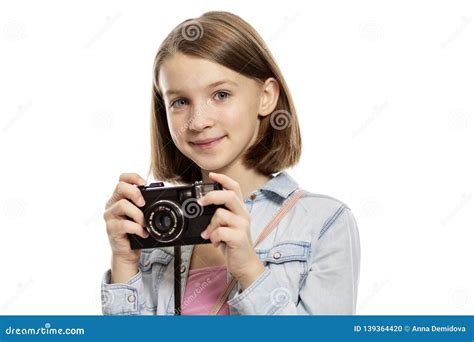 Smiling Cute Teen Girl With A Camera Close Up Isolated On White