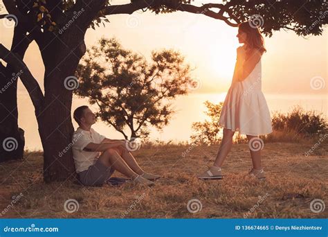 A Beautiful Couple Is Spending Time Together In A Park Stock Image
