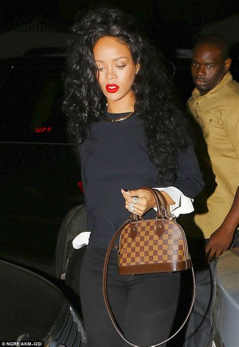 Rihanna Is Effortlessly Chic In Skinny Jeans And A Fitted Sweater At