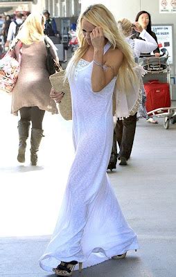 CONG COK Pamela Anderson Jets Into LA In See Through White Dress