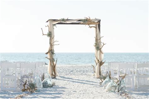 Driftwood Wedding Arch And Seashell Aisle Decor