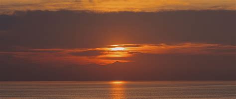 Download Wallpaper 2560x1080 Sea Reflection Sunset Horizon Dual Wide