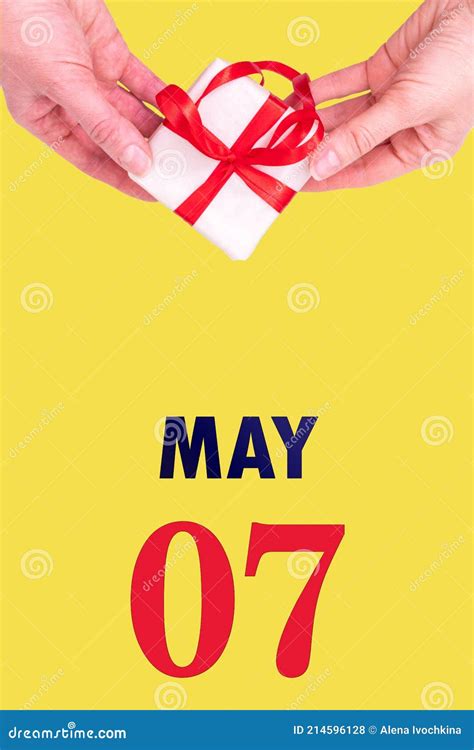 May 7th Festive Vertical Calendar With Hands Holding White T Box