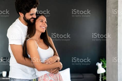Beautiful Young Loving Couple Bonding To Each Other While Man Embracing His Girlfriend Stock