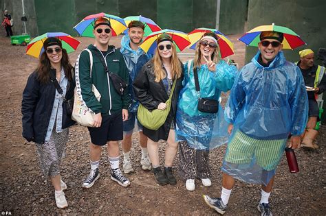 UK Weekend Weather Forecast Glastonbury Revellers Swamp Skimpy Outfits For Rain Coats Daily