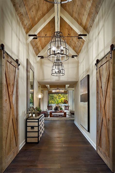 An Open Hallway With Wooden Doors Leading To The Living Room