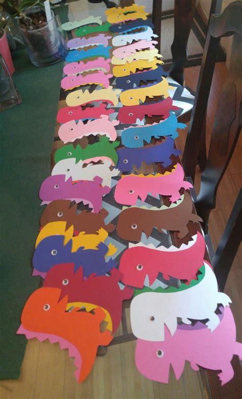 Collect your kids' old rain boots, an umbrella, or a watering can along with faux flowers and ribbon. Dinosaur Door Decs! | Door decorations college, Door decs ...