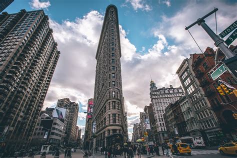 Burnham, the flatiron building is considered the oldest and possibly, one of the. Flatiron Building, New York City, cityscape, taxi, clouds ...