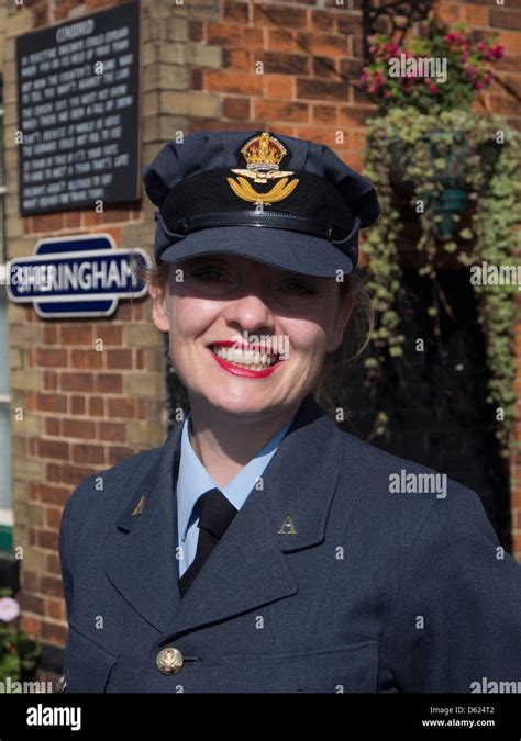 Woman Dressed In Raf Uniform For 1940s Weekend On Sheringham Station In