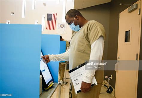 A Cook County Jail Detainee Uses A Touch Screen To Cast His Votes At