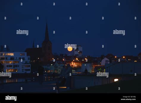 The Full Moon Rises Over The Skyline Of The Town Sønderborg In Denmark