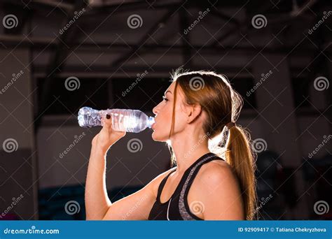 Fitness Woman Drinking Water From Bottle Muscular Young Female At Gym