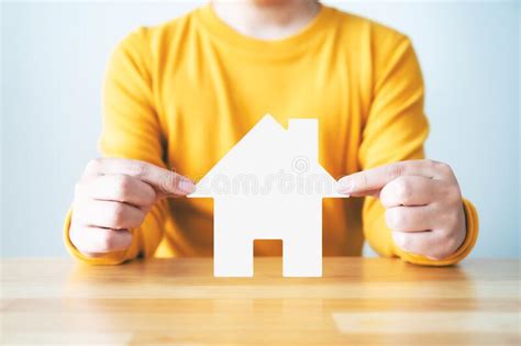 Man Hands Protect House Icon On Wood Table Stock Photo Image Of Hand