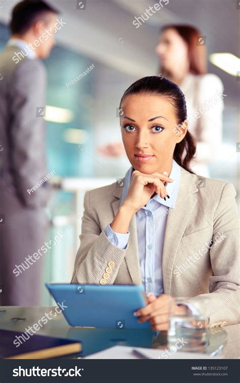 Portrait Of Confident Employee With Touchpad Looking At Camera On