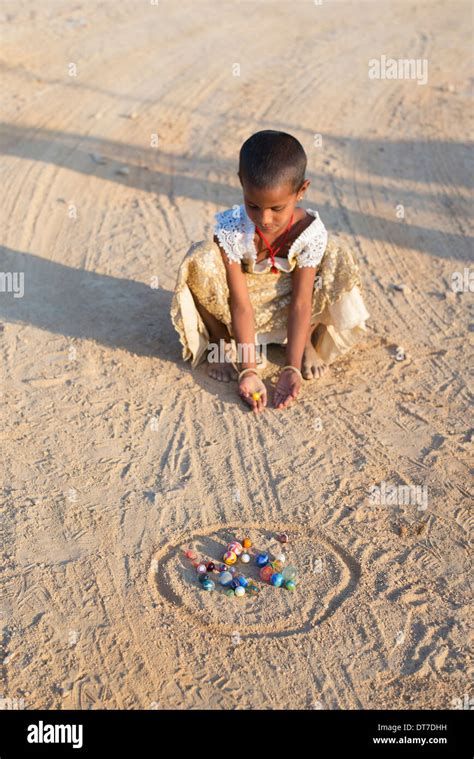 Children Playing Marbles Hi Res Stock Photography And Images Alamy
