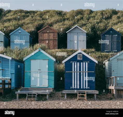 Two Rows Of Colorful Beach Huts In Milford On Sea New Forest Uk Stock