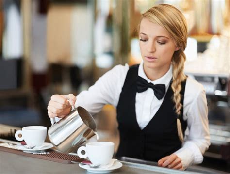 A Waitress Pouring Coffee In A License Images 11170991 Stockfood