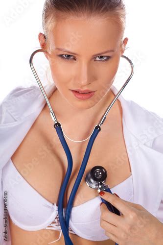 Sexy Doctor With Stethoscope Listening Her Heart Stock Photo And