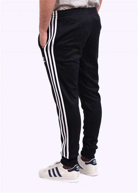 It quickly became a legendary look in the street style world. adidas Originals SST Cuffed Track Pants - Black