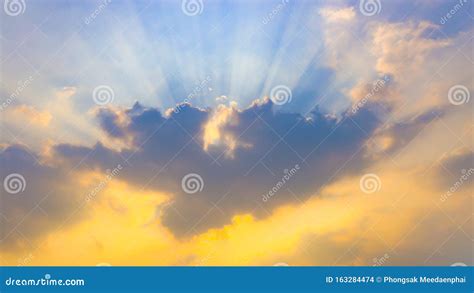 Sunlight Sunrays Or Sunbeams Over Clouds And Blue Sky Like Heaven For