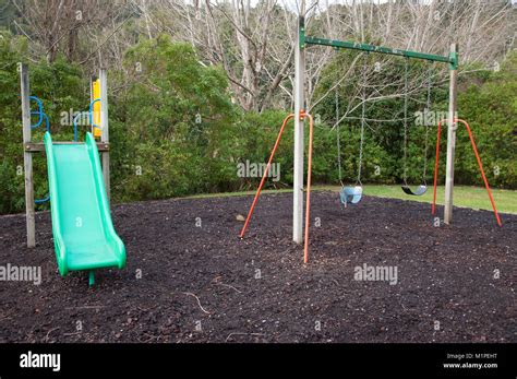 Playground Slide And Swings Stock Photo Alamy
