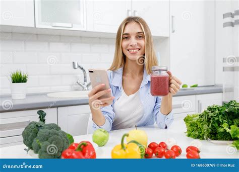 Cute Blonde Girl Drinking Smoothie And Making A Selfie Stock Image Image Of Food Light 168600769
