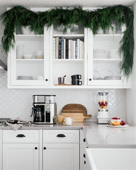 Christmas ribbon & bow cabinets (source unknown) garland in kitchen | Kitchen, Kitchen cabinets, Home decor