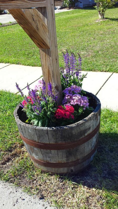 Arrange ivy between the holders. Mailbox Whiskey Barrel Filled with Spring Flowers ...