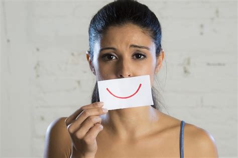 Young Woman Hiding Her Sadness Behind Smiling Depression Connected