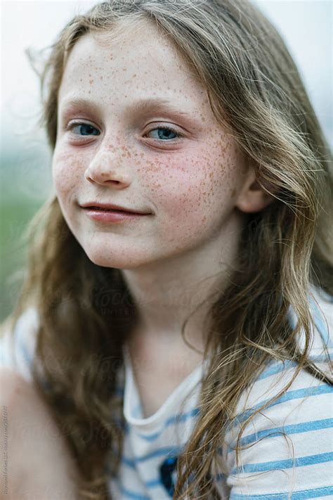 Portrait Of Pretty Young Redhead Girl With Freckles With Smile By