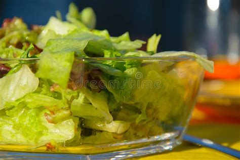 Closeup Shot Of Fresh Green Lettuce Salad In A Glass Bowl Stock Image