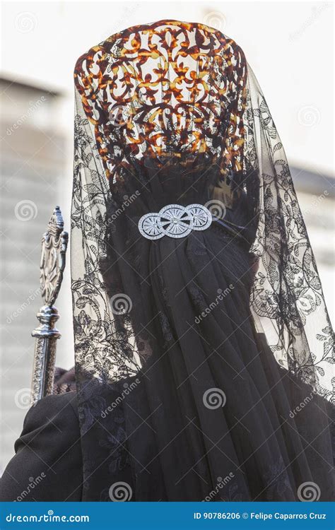 Woman Dressed In Mantilla During A Procession Of Holy Week Stock Photo