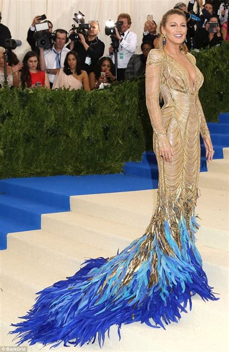 Blake Lively Is A Goddess In Gold And Feather Gown At The Met Gala