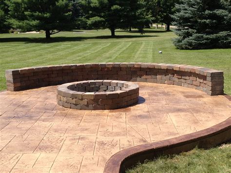 Stamped Concrete Patio With Fire Pit And Sitting Wall Clarskon Mi