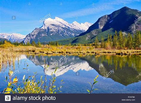 Mount Rundle Reflected In Calm Waters Of Vermillion Lakes Banff