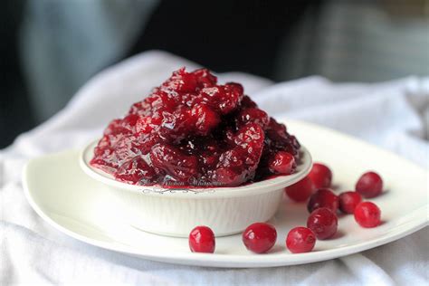 Holding the orange above a bowl, slice the sections of orange (supreme) and drop them into the bowl. The best Cranberry Relish... ever! No really, like EVER ...