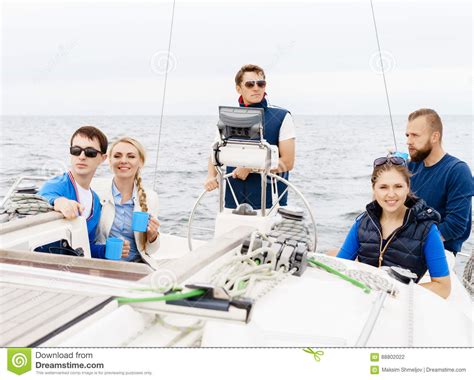 Happy Friends Traveling On A Yacht And Drinking Tea Stock Photo Image