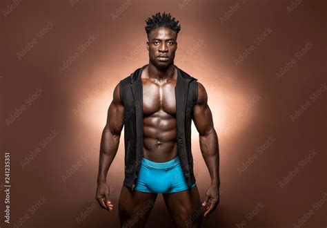Muscular African American Black Athletic Fitness Model Wearing Blue Underwear And Black Hoodie