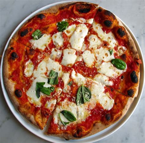 Amuse Bouche Basil Brick Oven True Italian Pizza At The Mouth Of